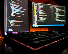 img of computer with HTML code